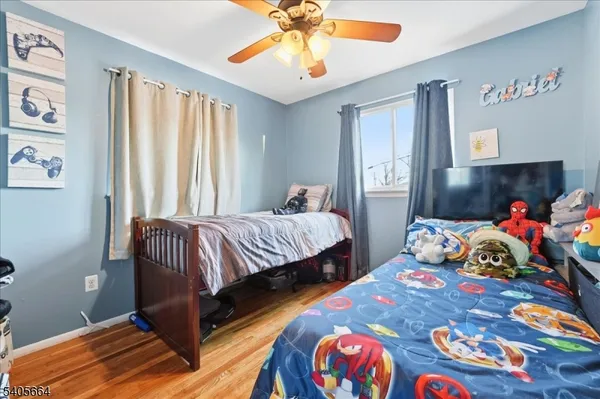 a bedroom with bed and window