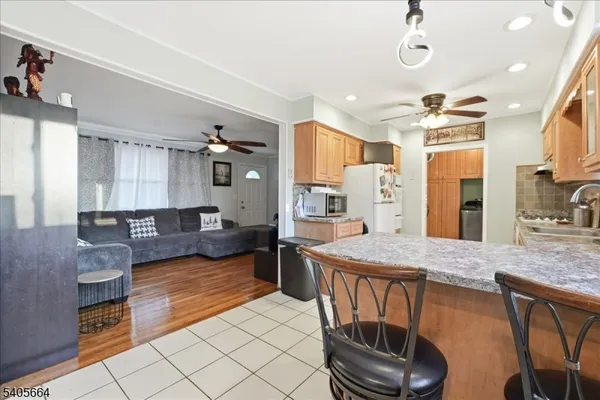 a kitchen with granite countertop lots of counter top space and breakfast area
