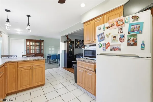a kitchen with a refrigerator and a sink
