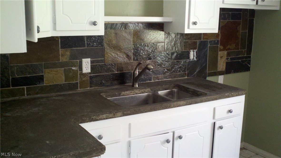4619 15th Street Northwest Canton, OH 44708 - Photo 4 of 26 Solid wood white cabinets. Concrete counter tops with an undermout sink.