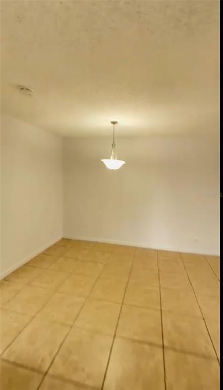 2546 Lemon Tree Lane, Unit G Orlando, FL 32839 - Photo 11 of 28 a view of an empty room with a window