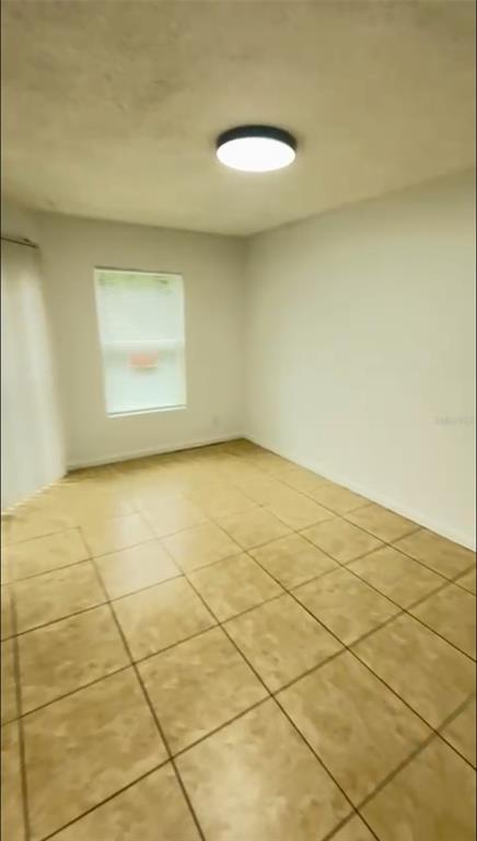 2546 Lemon Tree Lane, Unit G Orlando, FL 32839 - Photo 13 of 28 a view of a room with a white wall and a window