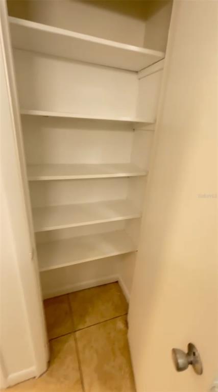 2546 Lemon Tree Lane, Unit G Orlando, FL 32839 - Photo 17 of 28 a view of walk in closet with empty racks