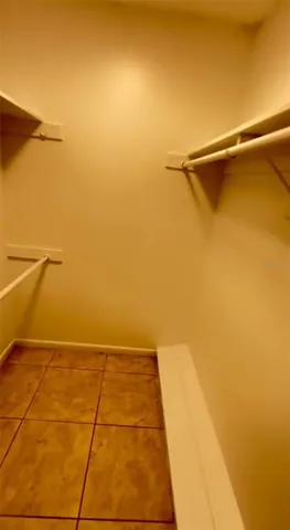 a bathroom with a granite countertop window a toilet and a shower