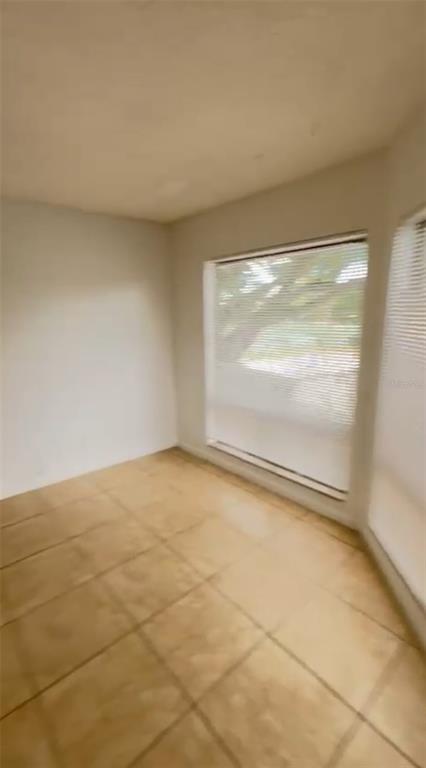 2546 Lemon Tree Lane, Unit G Orlando, FL 32839 - Photo 2 of 28 a view of an empty room with a window