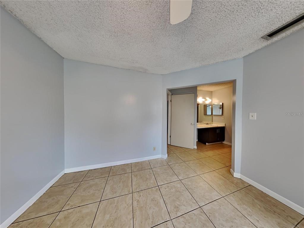 2546 Lemon Tree Lane, Unit G Orlando, FL 32839 - Photo 25 of 28 a view of an empty room with a window