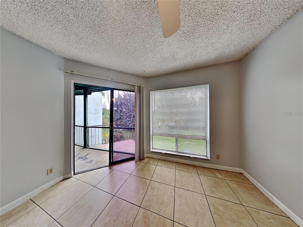 2546 Lemon Tree Lane, Unit G Orlando, FL 32839 - Photo 26 of 28 a view of an empty room with a window