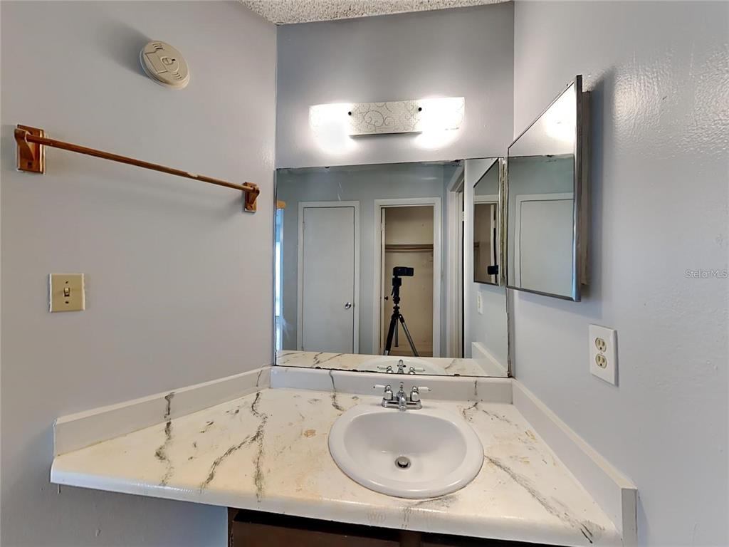 2546 Lemon Tree Lane, Unit G Orlando, FL 32839 - Photo 28 of 28 a bathroom with a sink and mirror