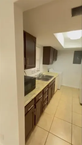 a kitchen with stainless steel appliances a sink and a microwave