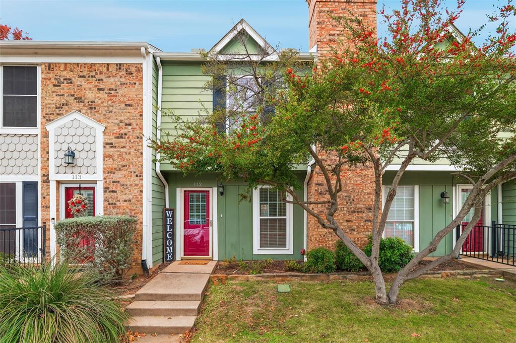 112 Churchill Lane Euless, TX 76039 - Photo 1 of 33 a front view of a house with garden