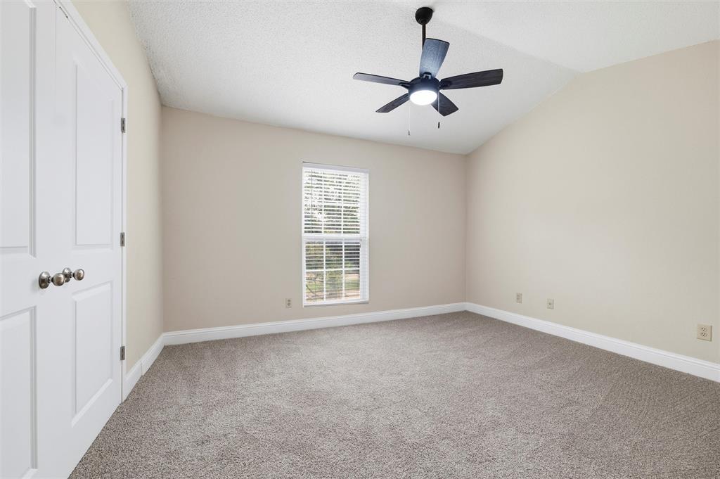 112 Churchill Lane Euless, TX 76039 - Photo 16 of 33 wooden floor in an empty room with a window