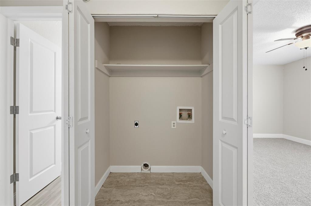 112 Churchill Lane Euless, TX 76039 - Photo 24 of 33 a view of a livingroom and a bathroom