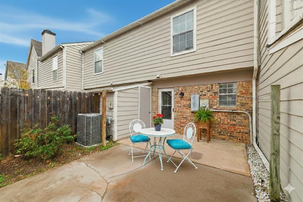 112 Churchill Lane Euless, TX 76039 - Photo 25 of 33 a view of a patio with table and chairs and potted plants