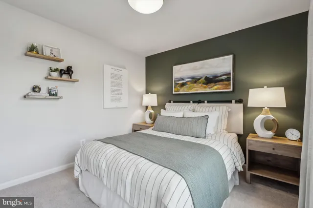 a bedroom with a bed and wall painting