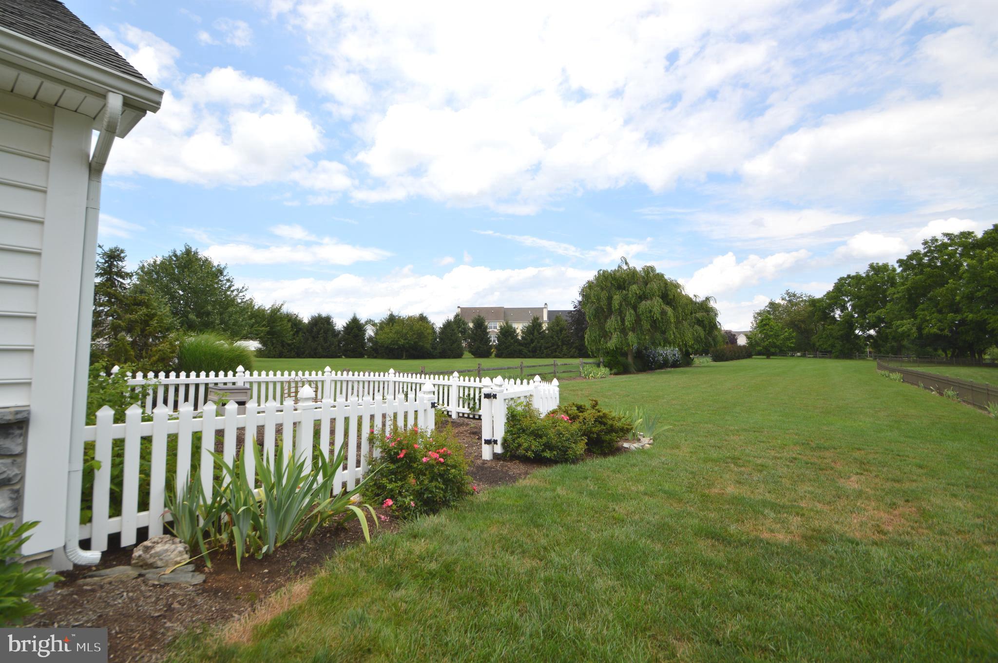 608 Belgian Way Lititz, PA 17543 - Photo 9 of 75 White picket fenced garden