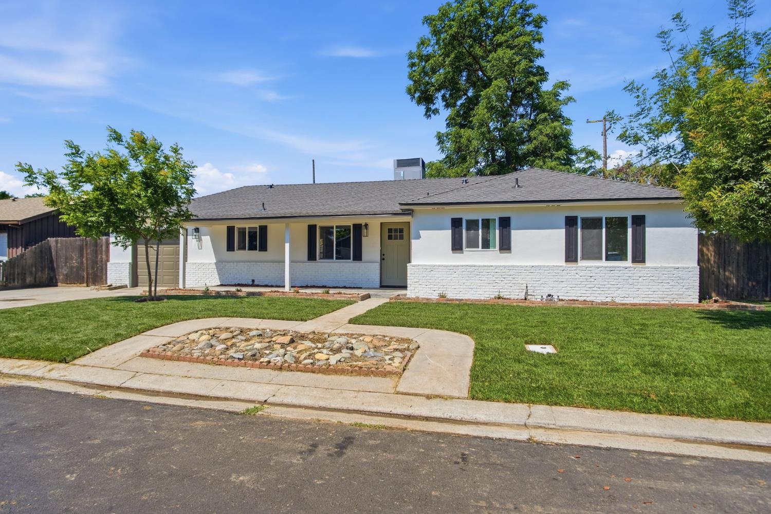 1451 Kent Way Modesto, CA 95355 - Photo 37 of 37 front view of a house with a yard