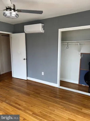 a kitchen with a refrigerator and cabinets
