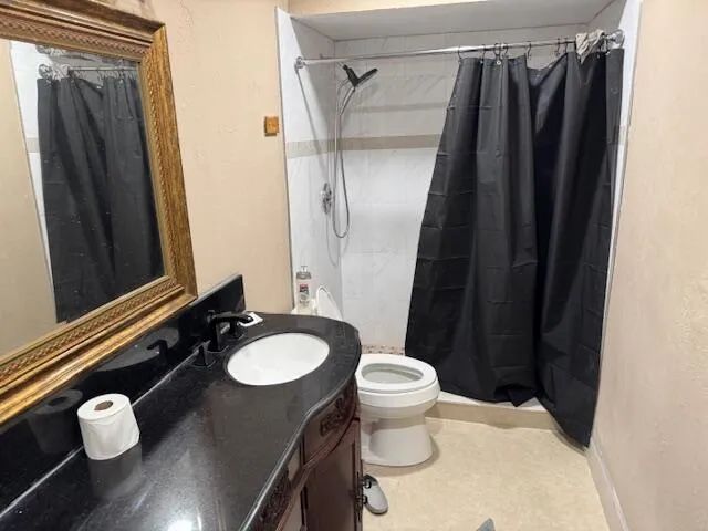 a kitchen with a sink and a refrigerator