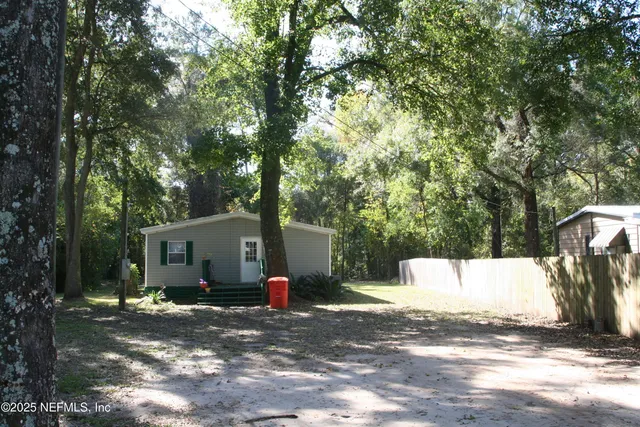 a kitchen with stainless steel appliances kitchen island granite countertop a refrigerator a stove top oven a sink and dishwasher