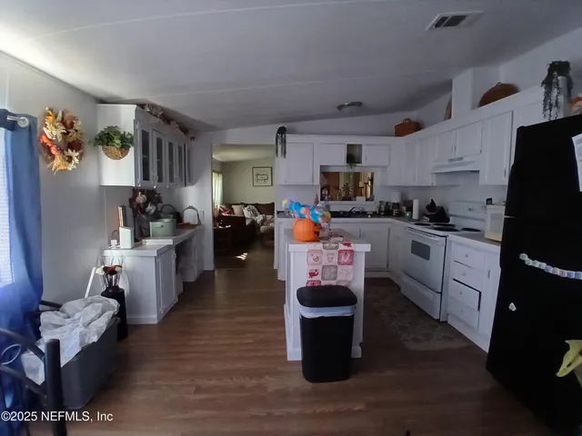 a view of a dining room with furniture