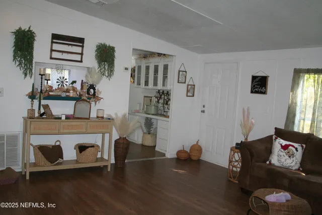 a living room with furniture and a table