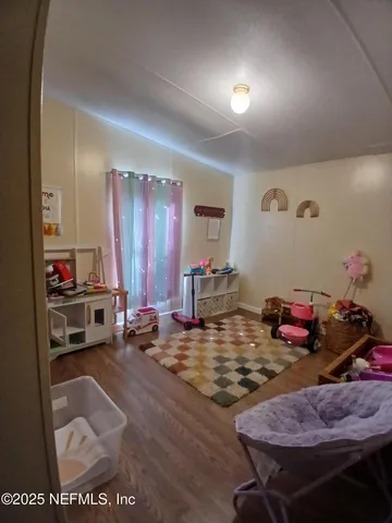 a bathroom with a sink a toilet and shower curtain