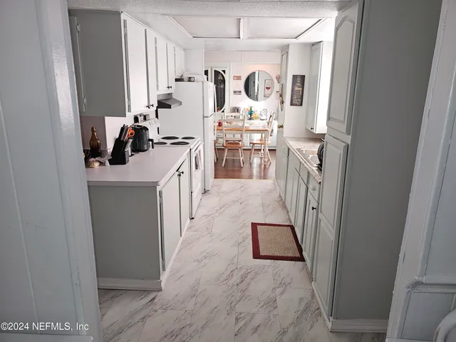 a view of a kitchen from the window