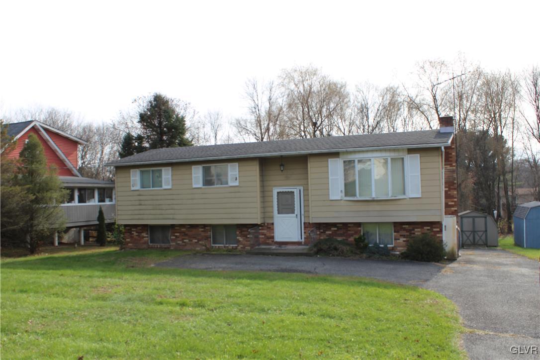 3210 Cherry Road Kunkletown, PA 18058 - Photo 1 of 12 a front view of a house with a yard