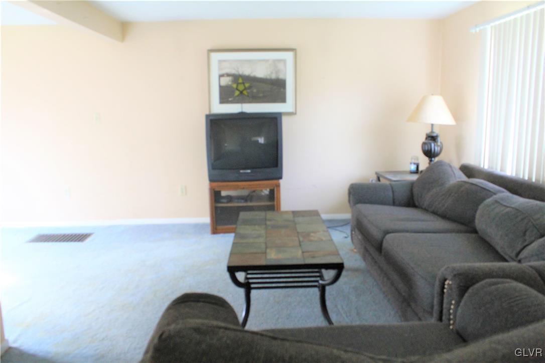 3210 Cherry Road Kunkletown, PA 18058 - Photo 3 of 12 a living room with furniture and a flat screen tv
