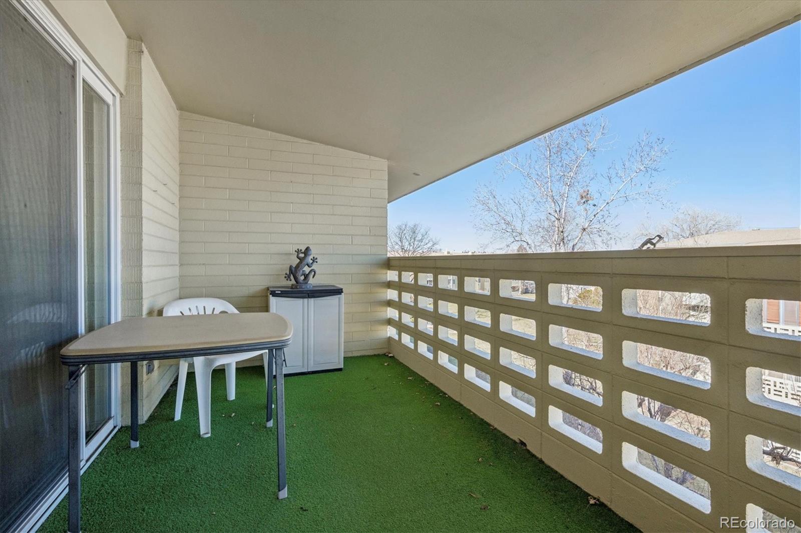 660 South Alton Way, Unit 2D Denver, CO 80247 - Photo 14 of 32 a balcony with a table and chairs