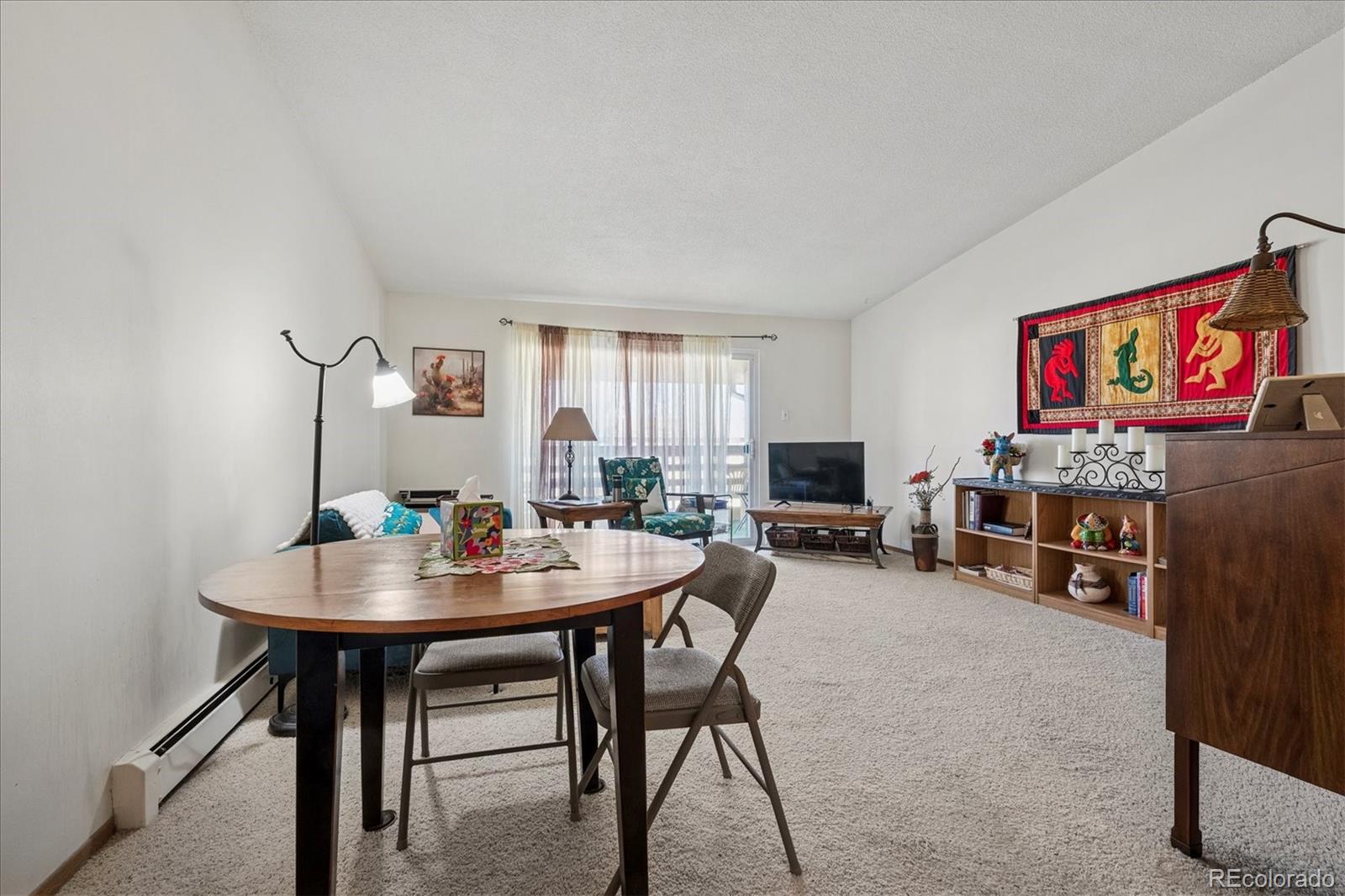 660 South Alton Way, Unit 2D Denver, CO 80247 - Photo 6 of 32 a view of a livingroom and dining room