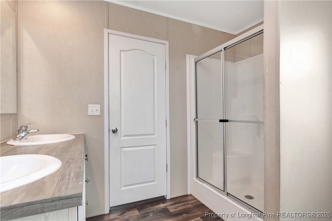 7879 Chicken Road Lumberton, NC 28360 - Photo 21 of 29 a bathroom with a sink and a mirror