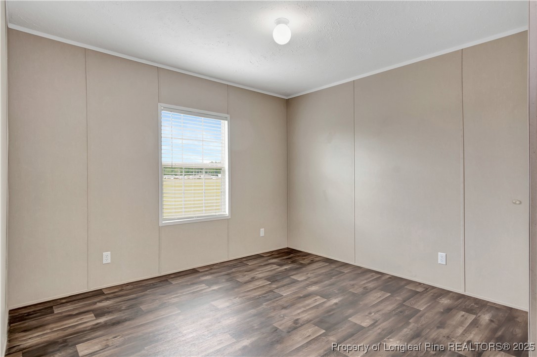 7879 Chicken Road Lumberton, NC 28360 - Photo 24 of 29 wooden floor in an empty room with a window