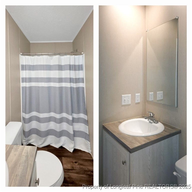 7879 Chicken Road Lumberton, NC 28360 - Photo 26 of 29 a bathroom with a sink and a mirror