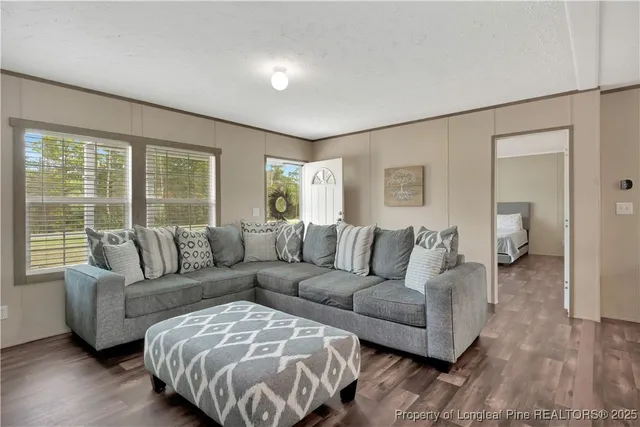 a living room with furniture and a large window
