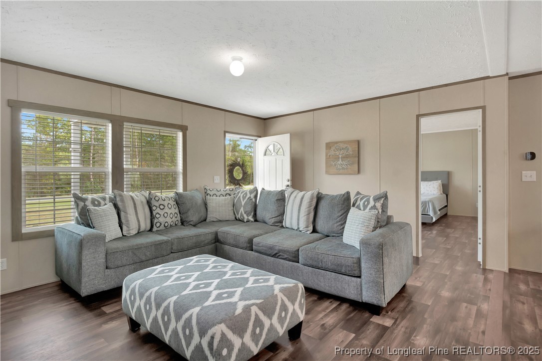 7879 Chicken Road Lumberton, NC 28360 - Photo 6 of 29 a living room with furniture and a large window