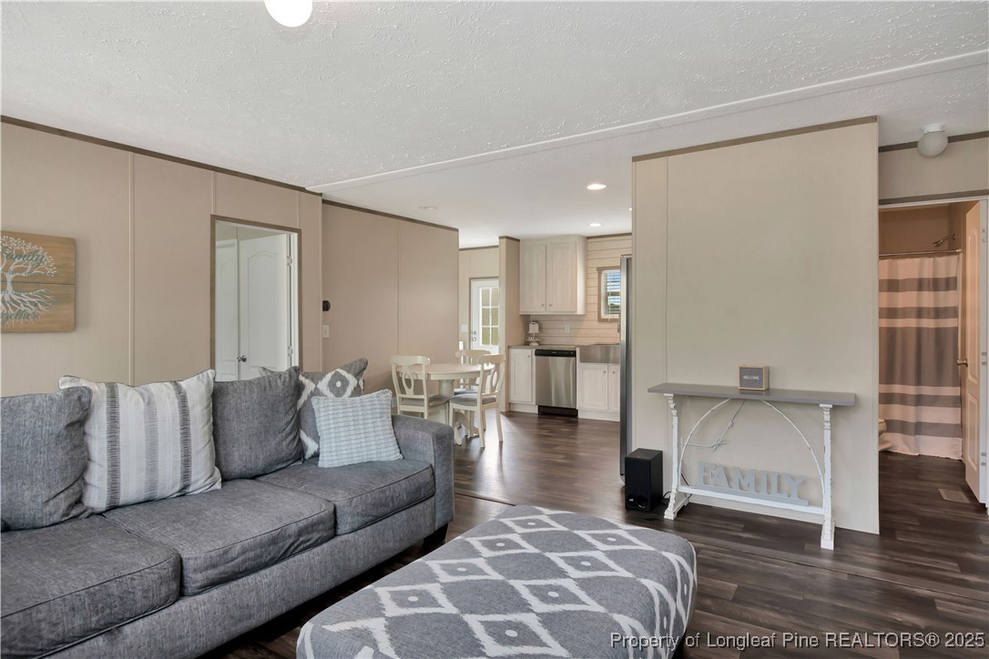 7879 Chicken Road Lumberton, NC 28360 - Photo 9 of 29 a living room with furniture and kitchen view