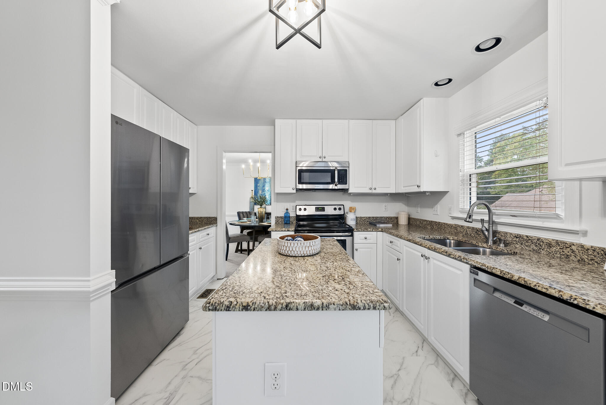 5316 Easthorpe Drive Raleigh, NC 27613 - Photo 10 of 53 a kitchen with granite countertop stainless steel appliances and a refrigerator