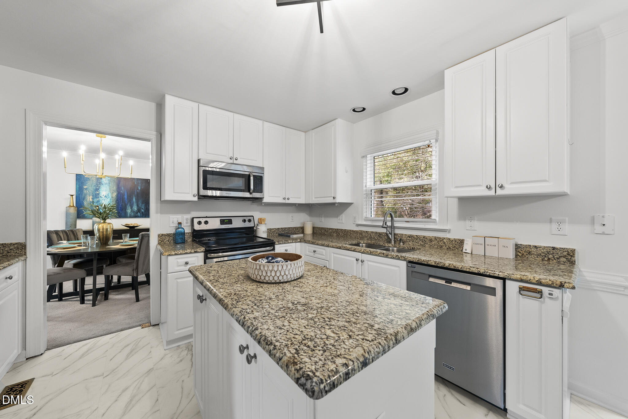 5316 Easthorpe Drive Raleigh, NC 27613 - Photo 11 of 53 a kitchen with a stove a sink and a microwave