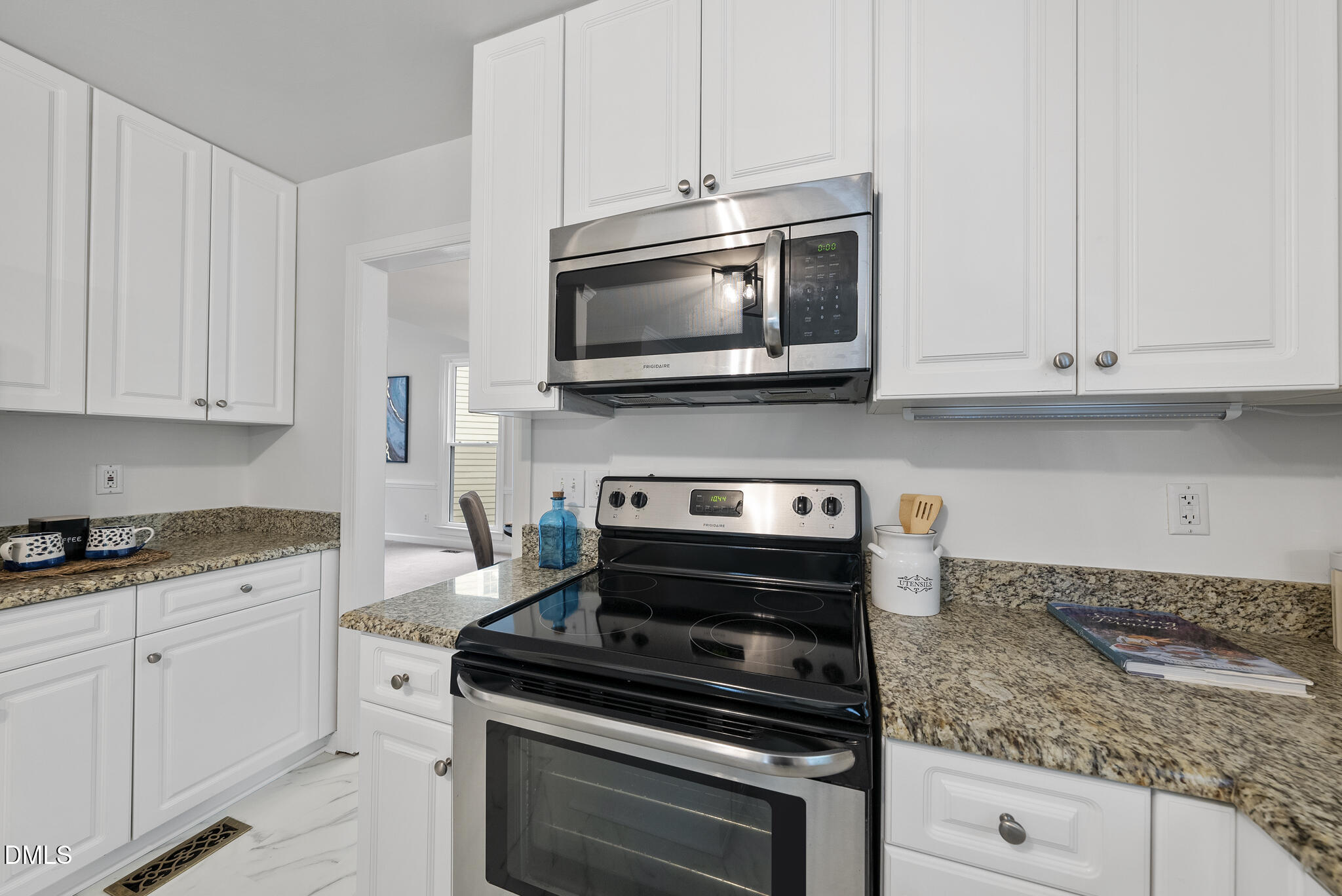 5316 Easthorpe Drive Raleigh, NC 27613 - Photo 13 of 53 a kitchen with appliances a sink and cabinets