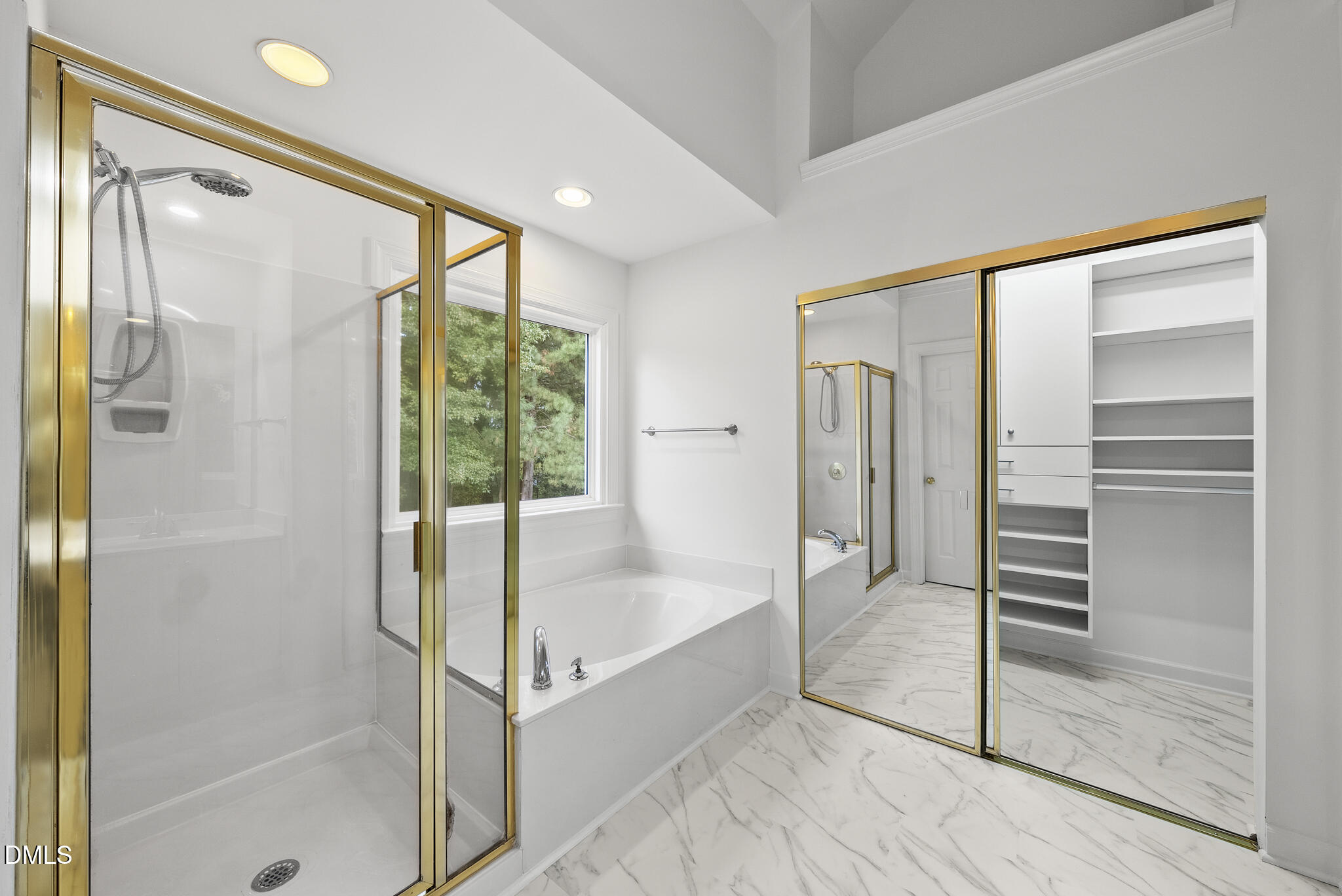 5316 Easthorpe Drive Raleigh, NC 27613 - Photo 25 of 53 a bathroom with a glass shower door and a bathtub