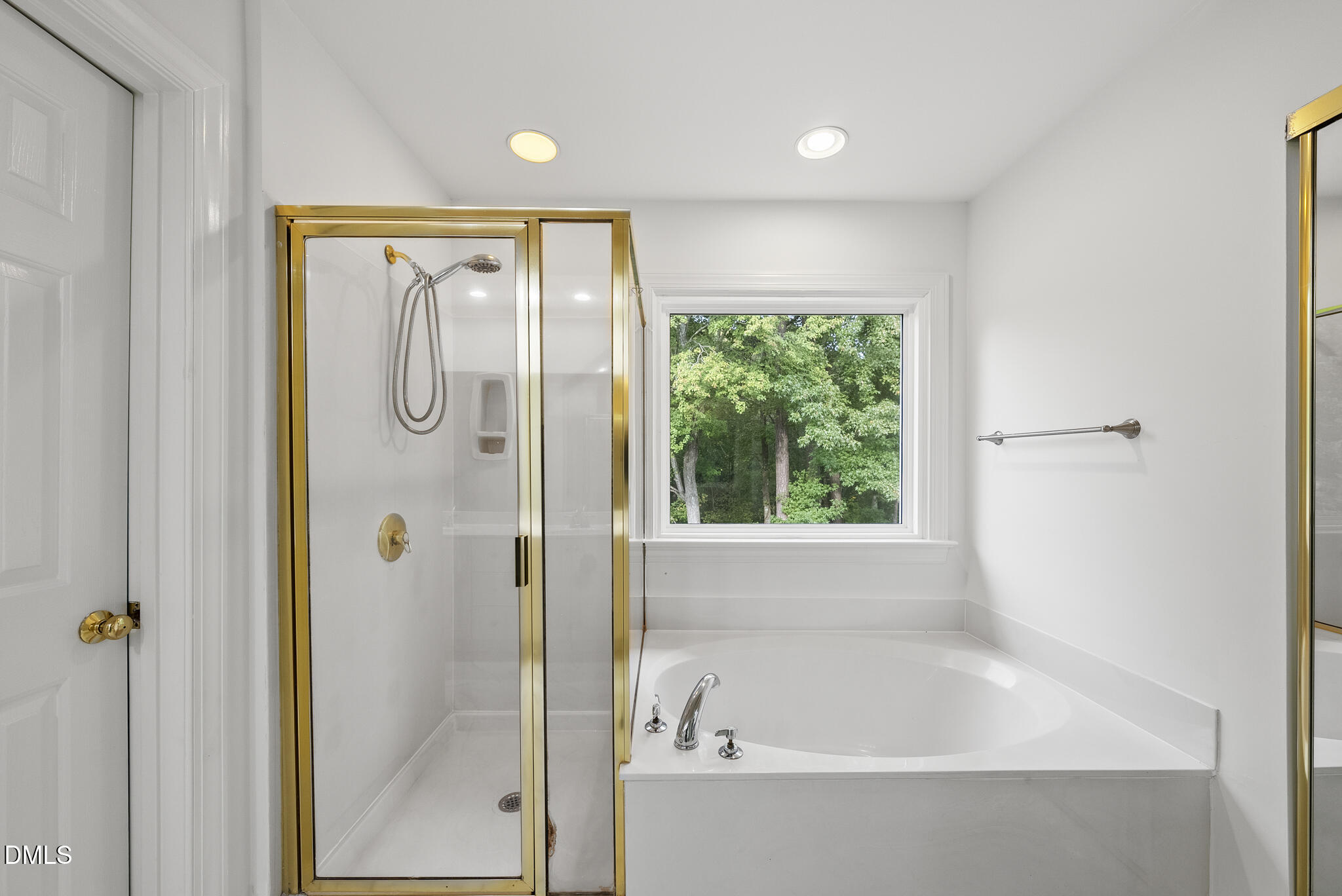 5316 Easthorpe Drive Raleigh, NC 27613 - Photo 26 of 53 a bathroom with a bathtub and a shower