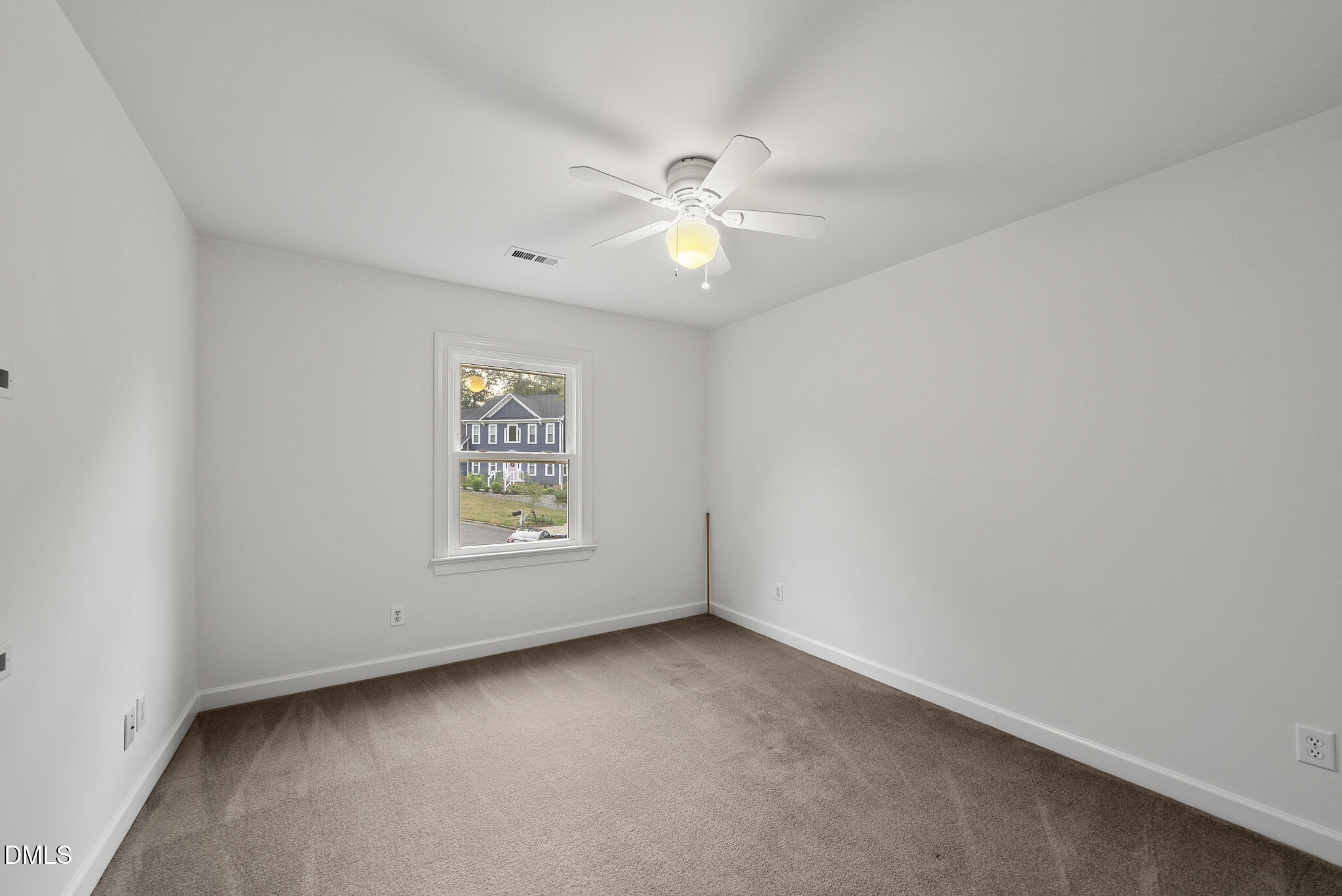 5316 Easthorpe Drive Raleigh, NC 27613 - Photo 28 of 53 an empty room with a window and a fan