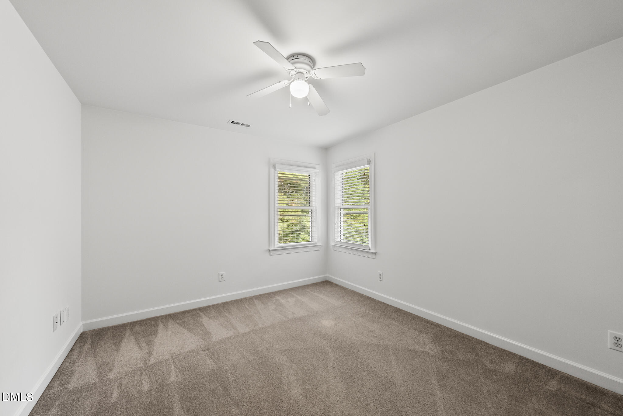 5316 Easthorpe Drive Raleigh, NC 27613 - Photo 32 of 53 an empty room with a window and a fan