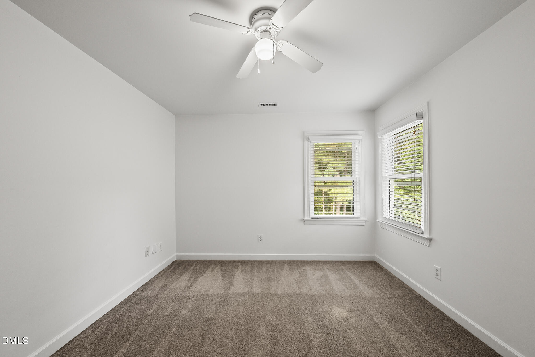 5316 Easthorpe Drive Raleigh, NC 27613 - Photo 33 of 53 an empty room with a window and a fan