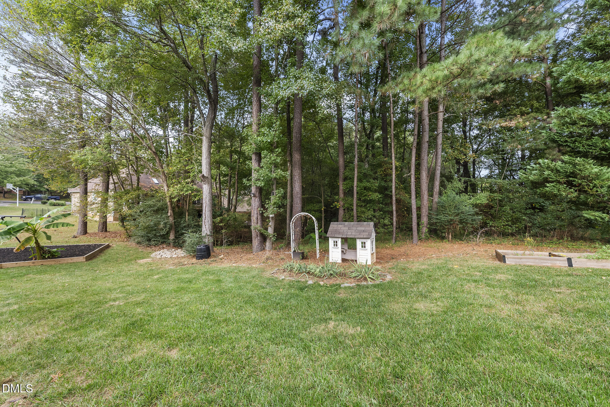 5316 Easthorpe Drive Raleigh, NC 27613 - Photo 39 of 53 a view of a park with large trees and a slide