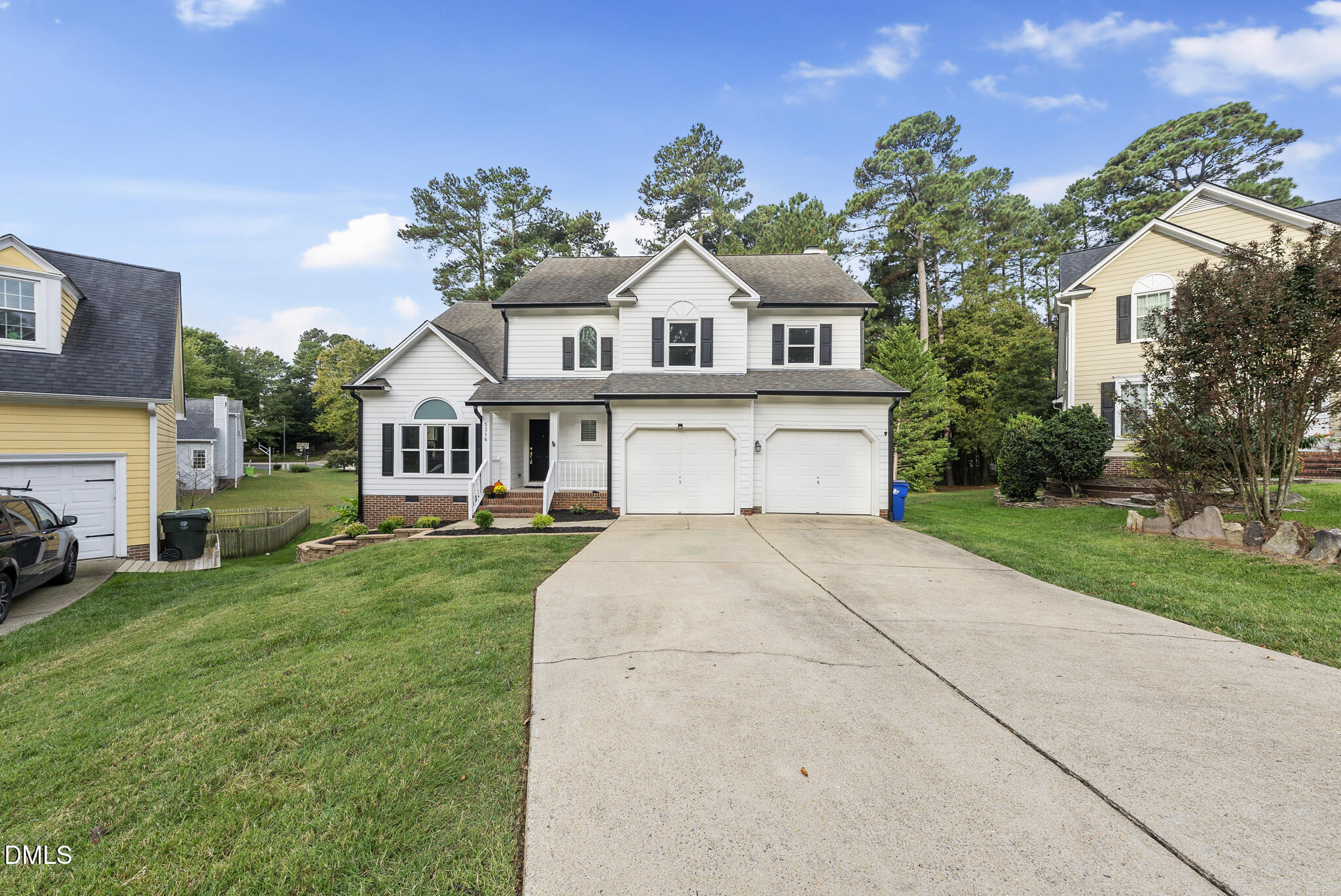 5316 Easthorpe Drive Raleigh, NC 27613 - Photo 40 of 53 a front view of a house with a yard and garage