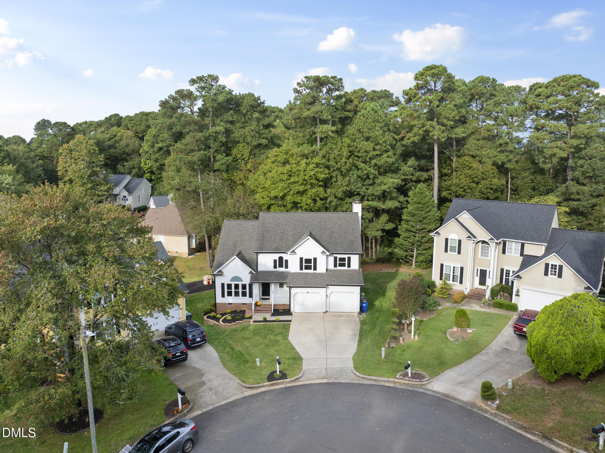 5316 Easthorpe Drive Raleigh, NC 27613 - Photo 46 of 53 a front view of a house with a garden and tree
