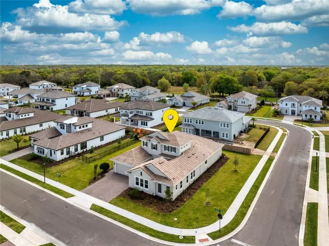 a view of a swimming pool with lounge chairs