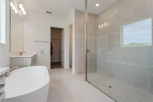 a bathroom with a bathtub and a shower